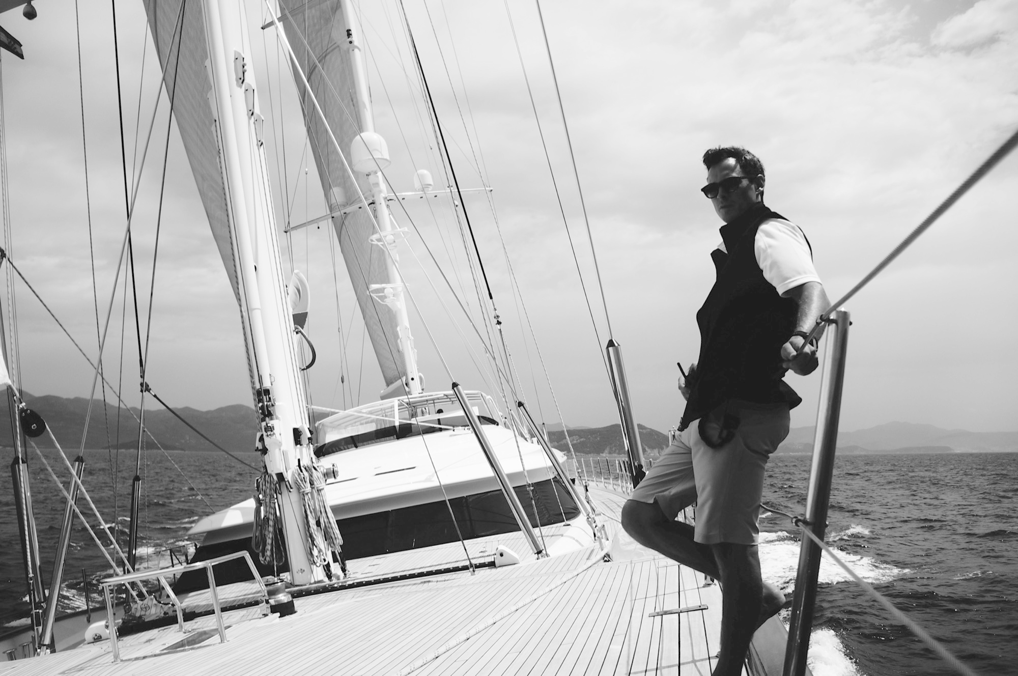 Matt on deck aboard a sailing yacht